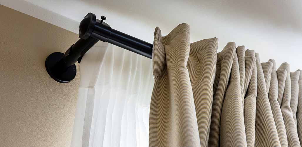 how far down from the ceiling should drapes be hung